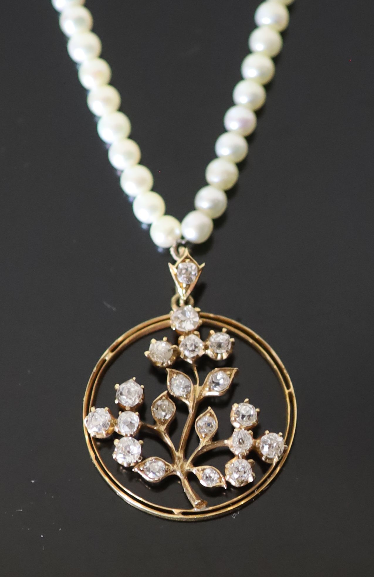 An early 20th century, gold, pearl and diamond set circular pendant necklace,